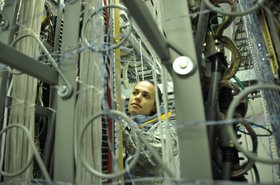 Senior Airman Sharon Navallo inspects central office wiring ithe US Air Force - credit US Air Force + Senior Airman Nicholas Caceres